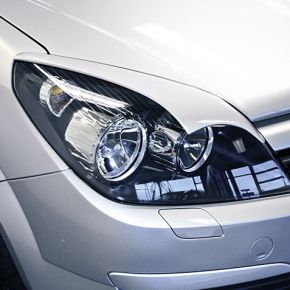 Opel Astra H priekinių žibintų apdaila